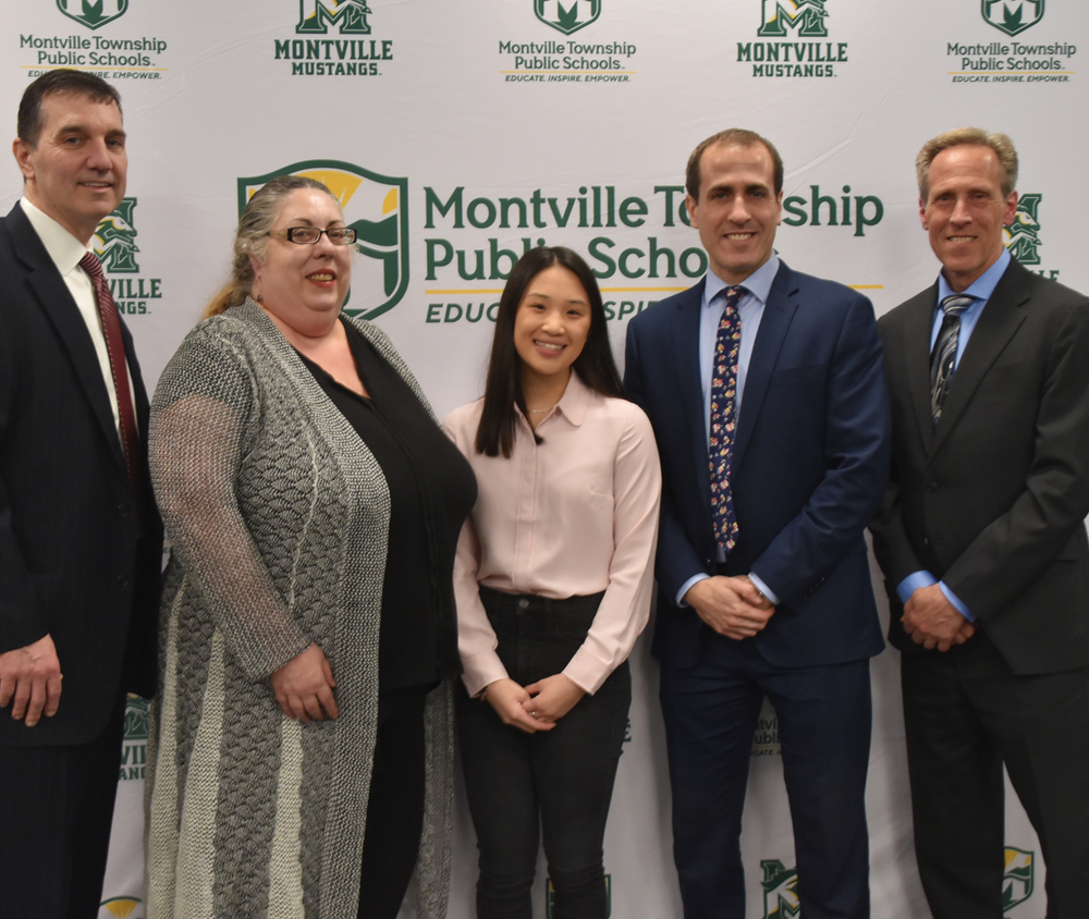 Jenna Iervolino recently presented to the Montville Township Board of Education. Through extensive research, the Montville Township High School senior developed an original algorithm for calculating secure passwords. Superintendent Dr. Thomas A. Gorman, Computer Club Advisor Laura Fuhrmann, MTHS Senior Jenna Iervolino, MTHS Principal Douglas Sanford, and Montville BOE President Dr. David Modrak.